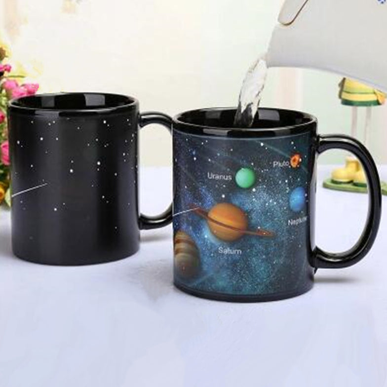 Heat-Changing Planet Mug: Coffee cup with a model of the Solar System.